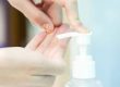 using hand sanitizer